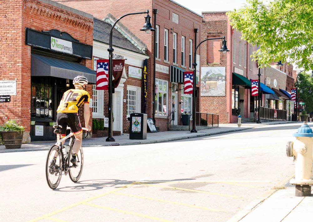 A man riding his bike at Downtown Wake Forest.