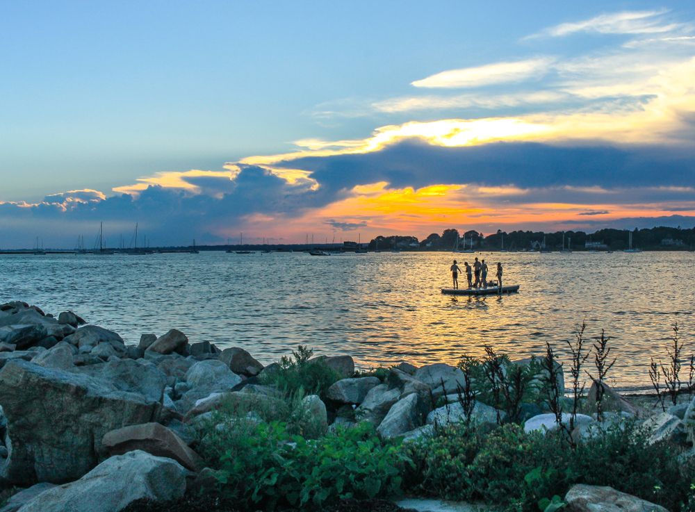 People on a boat at DuBois Beach waters.