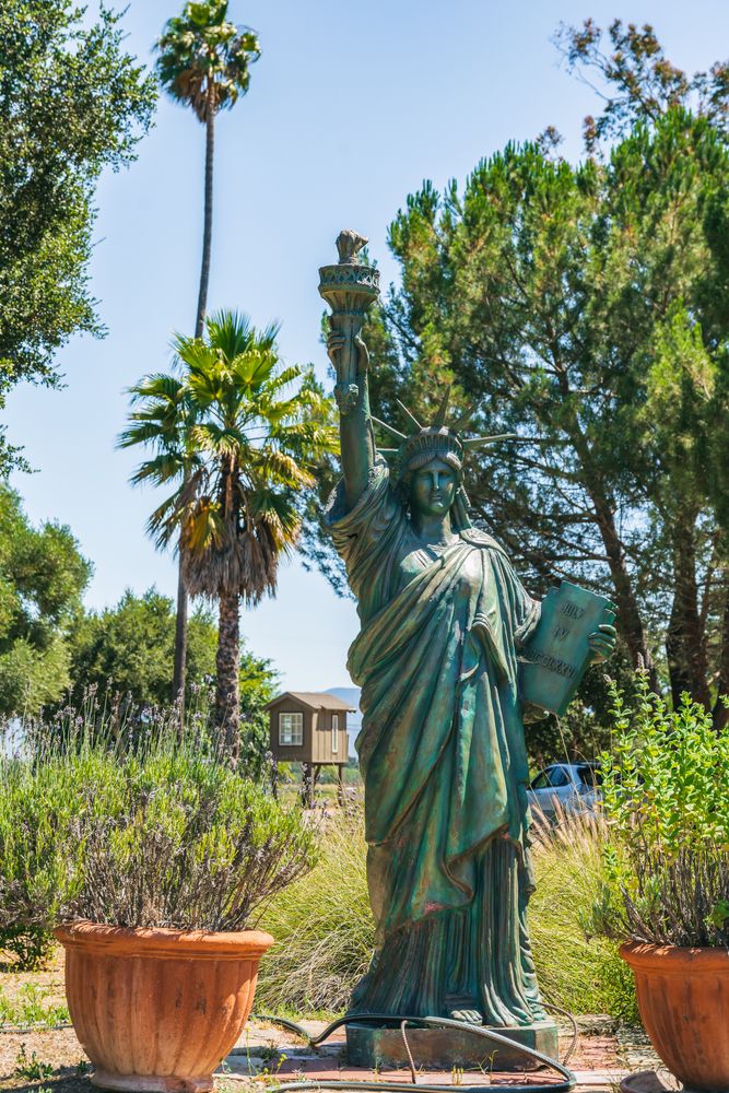 A smaller version of the statue of liberty at Clairmont Farms.