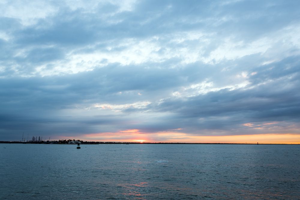 Sunset and body of water at Galveston Bay.