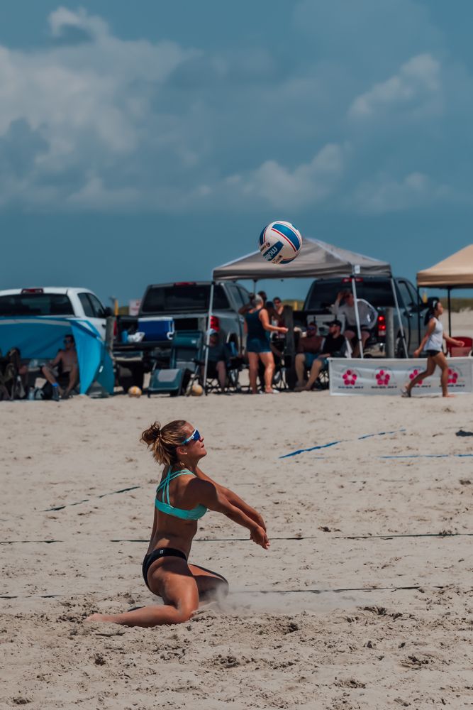 A woman playing beach volleyball at Apffel Beach Park.