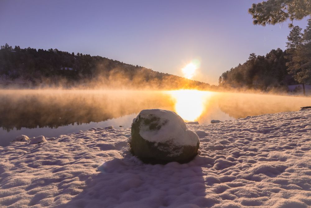 Mind boggling view of sunrise over the snow covered Alto Lake