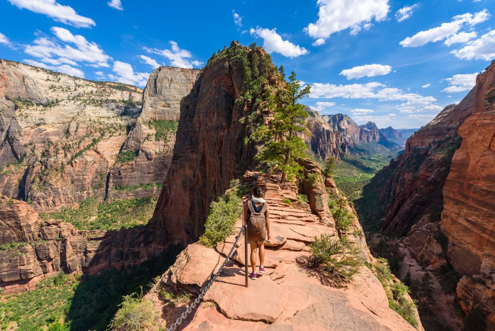 A young woman walking on the nature trail towards Angels Landing