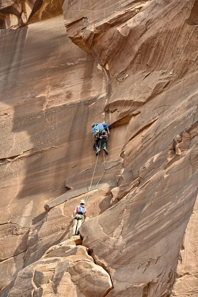 People rock climbing at Arches National Park