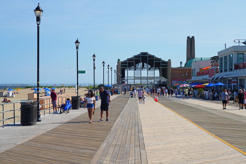People strolling around the Asbury Park Boardwalk