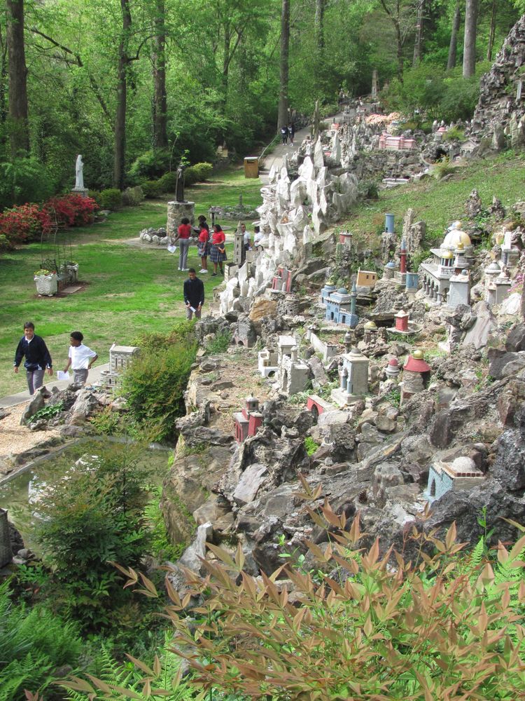 People looking at the mini stone architects at Ave Maria Grotto