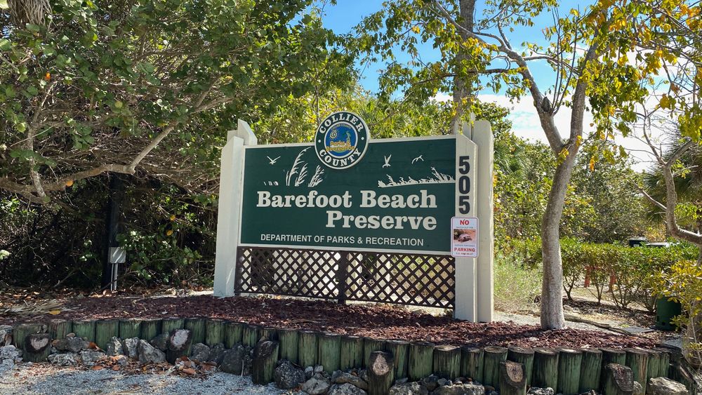 Welcome sign of Barefoot Beach Preserve