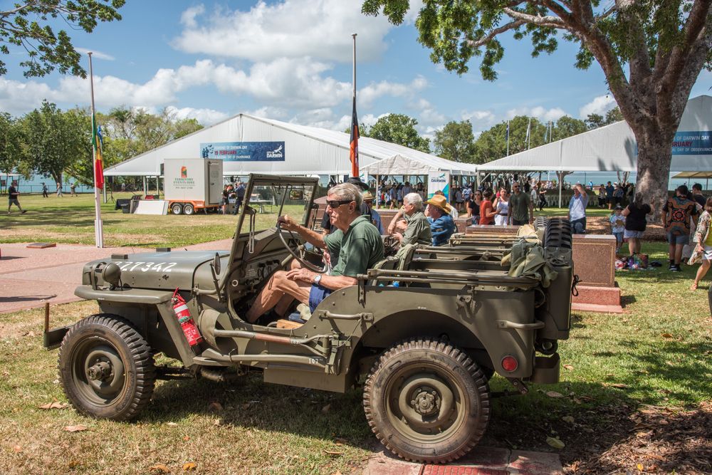 Senior citizens riding old military jeep at Bicentennial Park