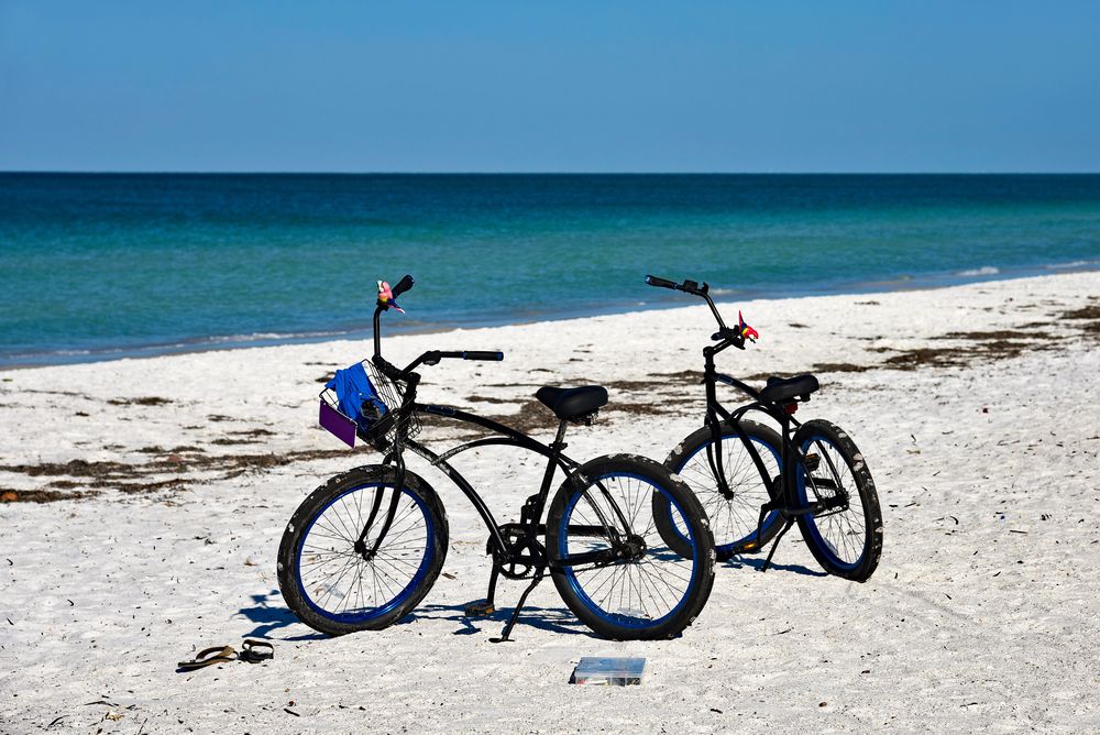 Bikes parked on a sandy shore at Anna Maria Island 