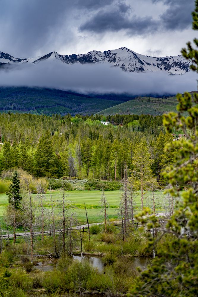 Breckenridge Golf Club with snow-capped mountain in the background