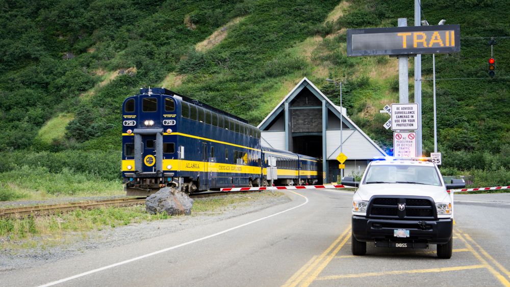 A train and a car at Whittier Tunnel