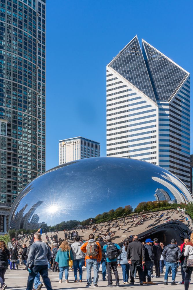 Visitors observing the Cloud Gate