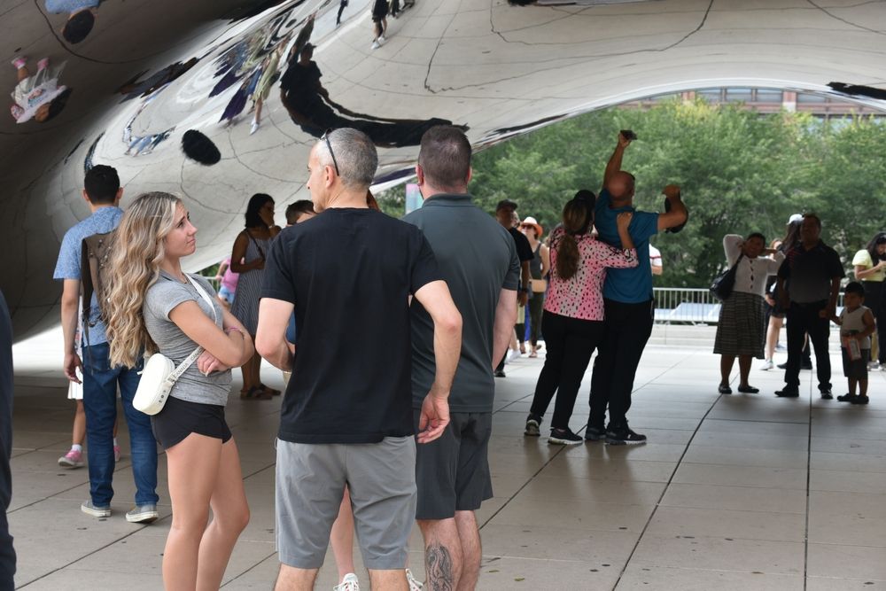 People having a closer look at the Cloud Gate