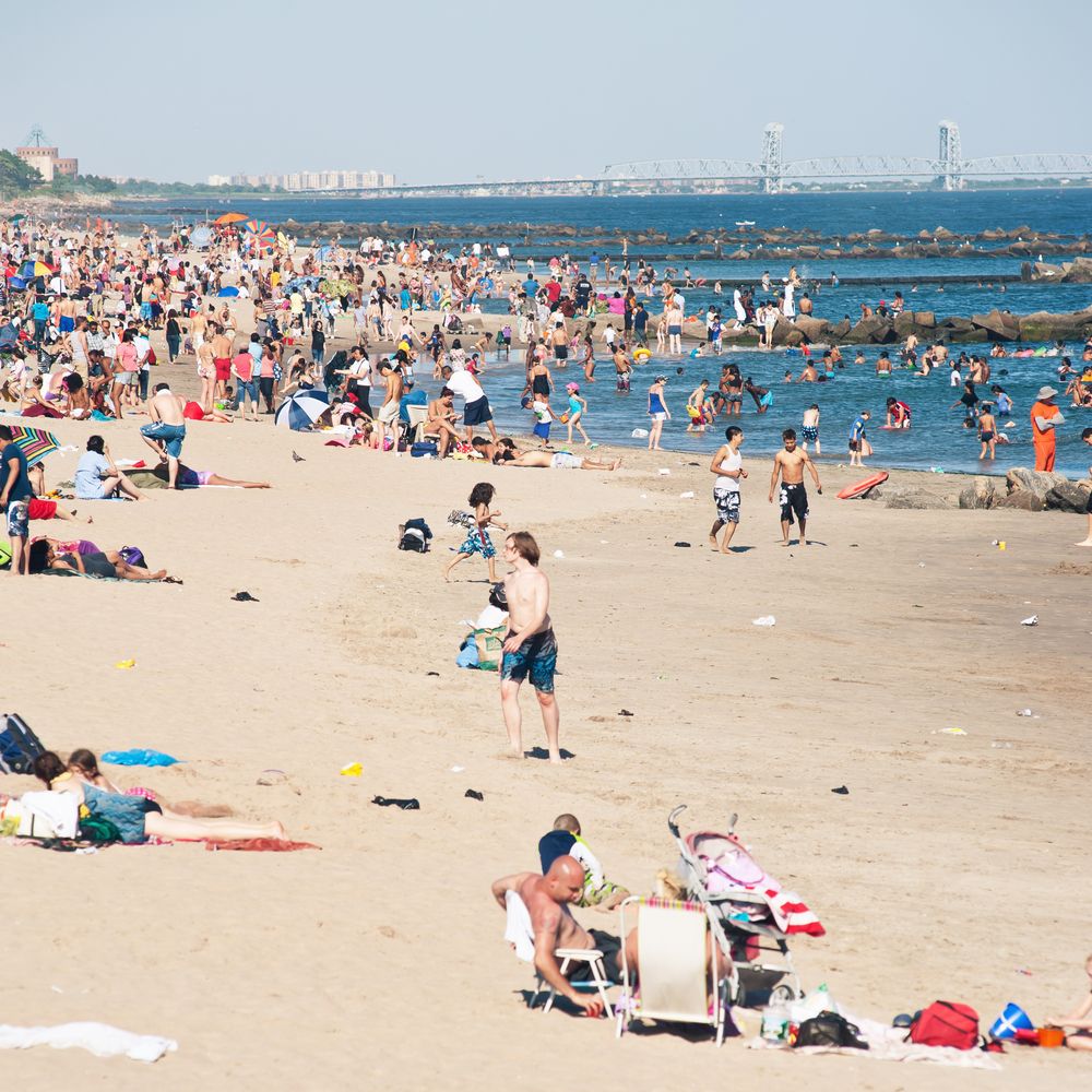 Crowd enjoying their day on the beach at Coney Island