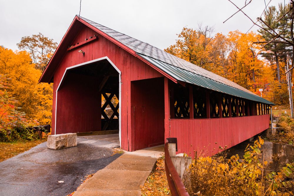 Beautiful red Creamery Covered Bridge during fall