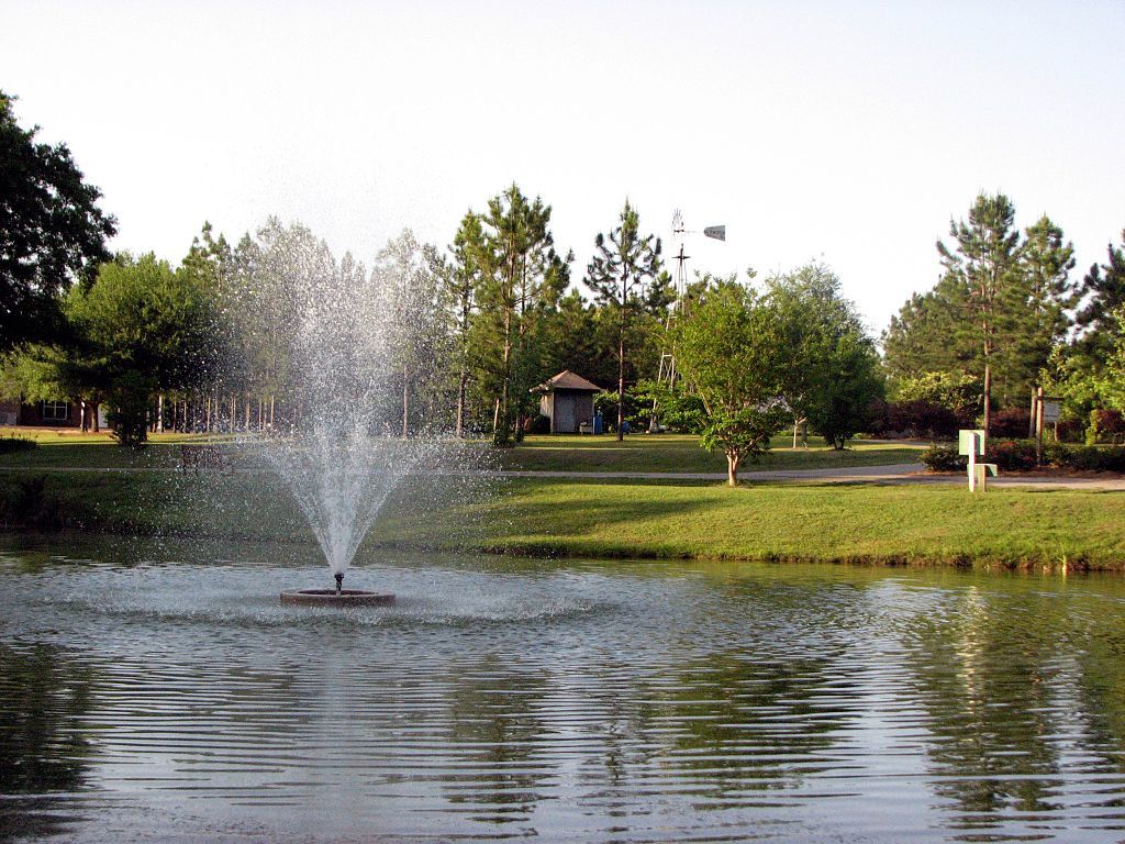 Fountain inside a pond at Dothan Area Botanical Gardens