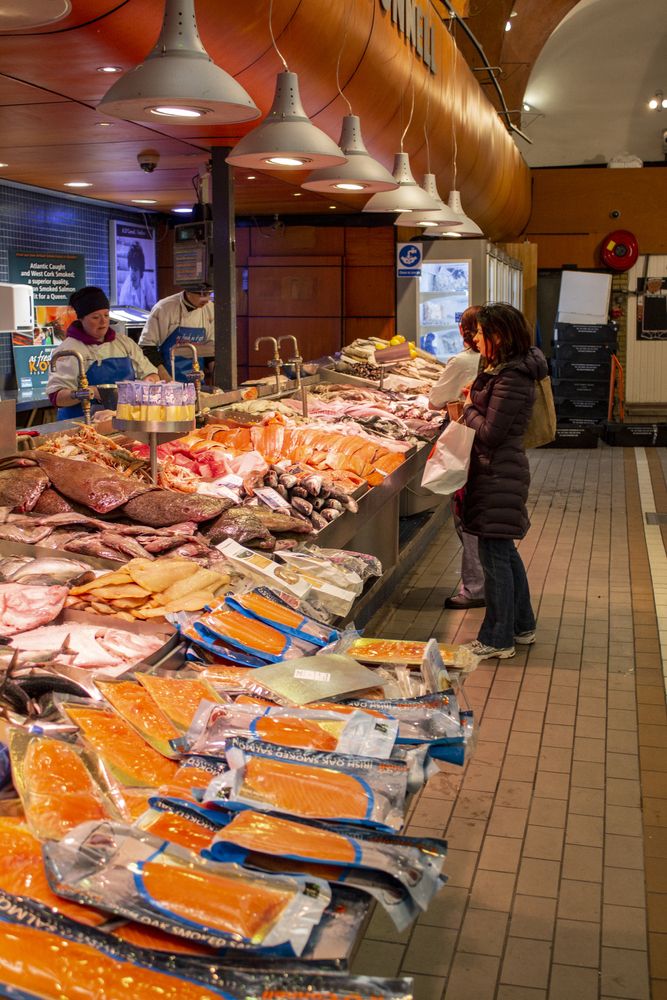 Vendors selling seafood at English Market