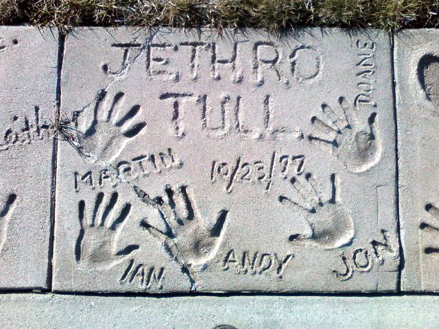 Handprints and names written on a concrete at Fargo-Moorhead Visitors Center