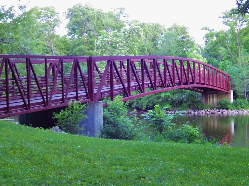 Arched wooden bridge at Flint River Trail