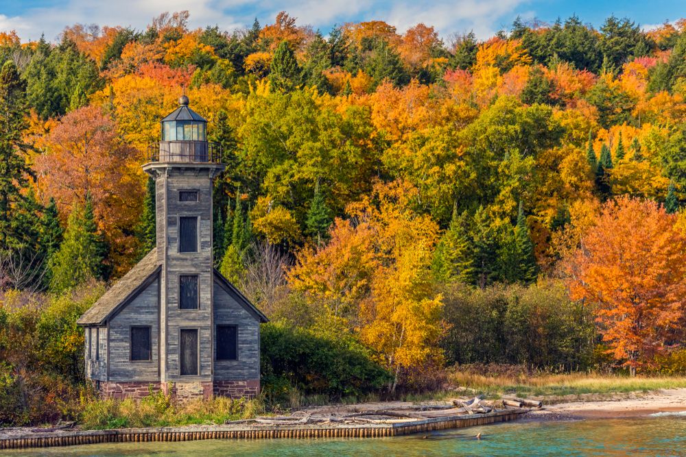 Grand Island East Channel Lighthouse surrounded by autumn leaves