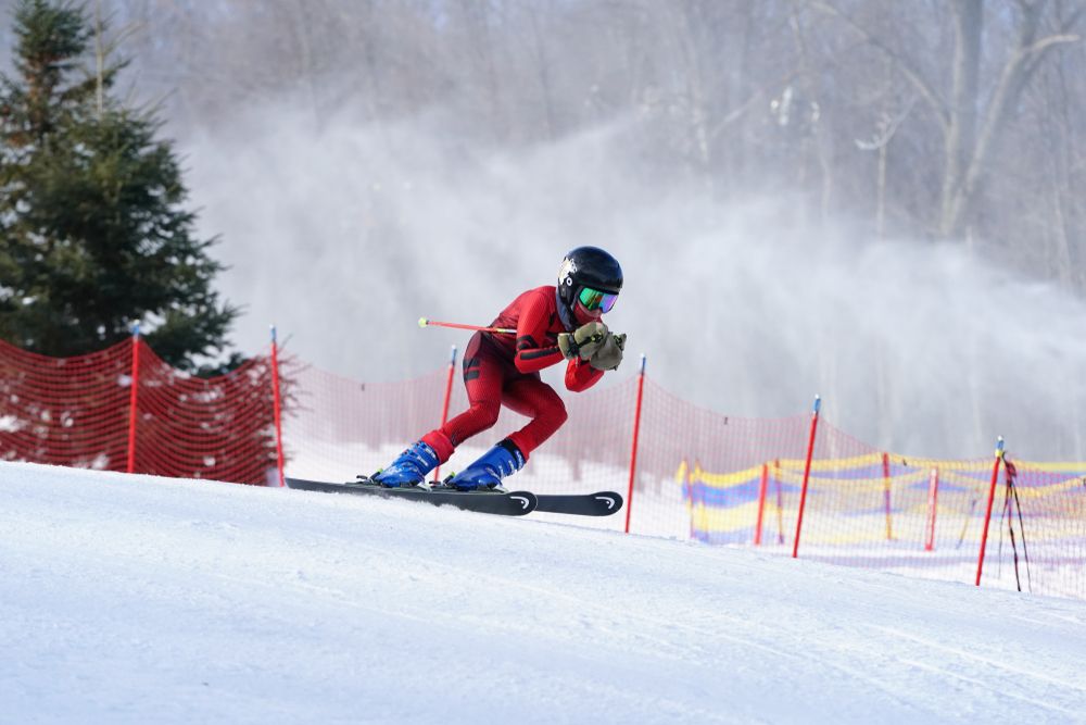 A young man skiing down the Granite Peak Ski Area