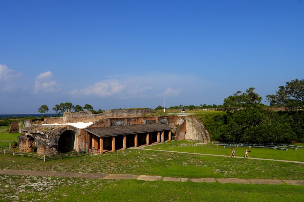 Green grass with the old looking fort pickens.