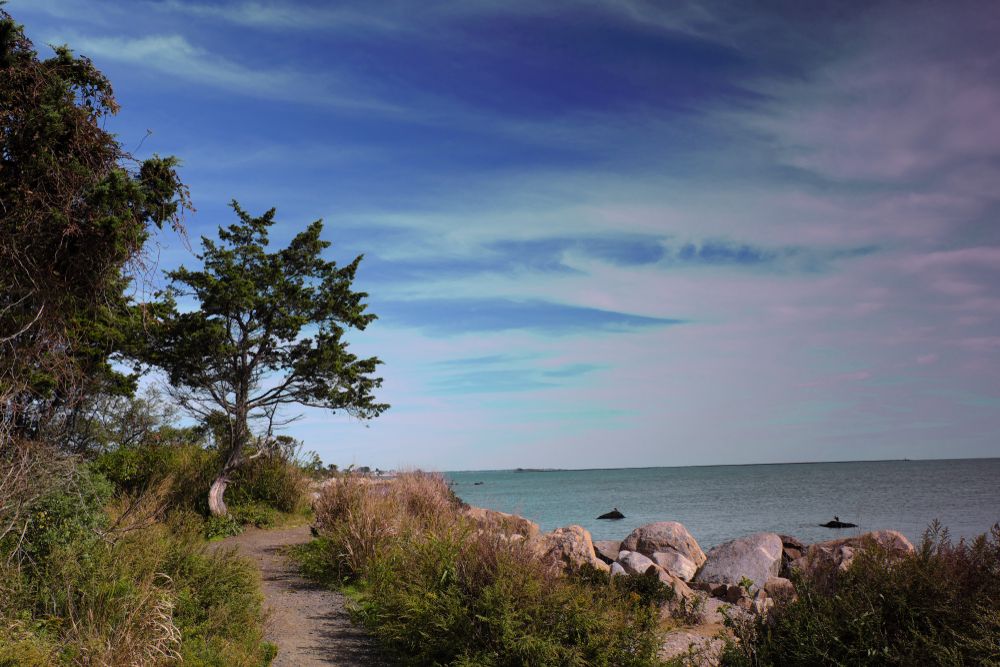 Narrow path beside the rock and beach at the Hammonasset Beach State Park