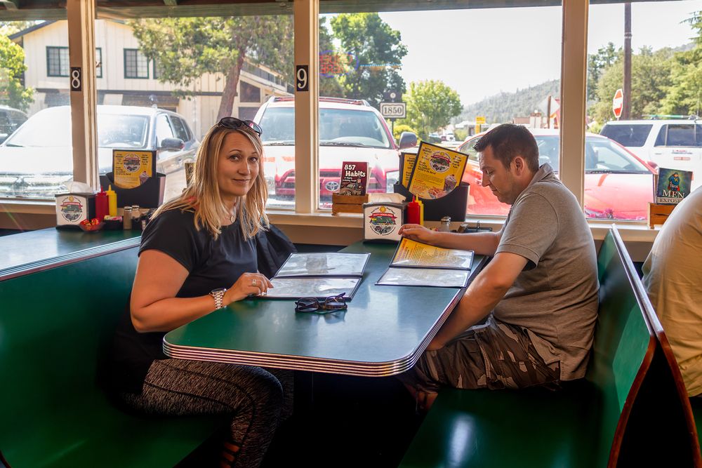A couple dining at Happy Burger Diner