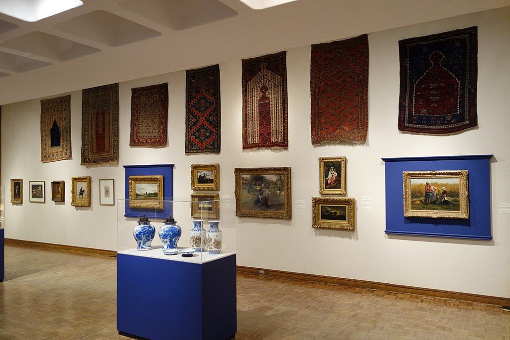 Display of rugs and vases at Huntington Museum of Art