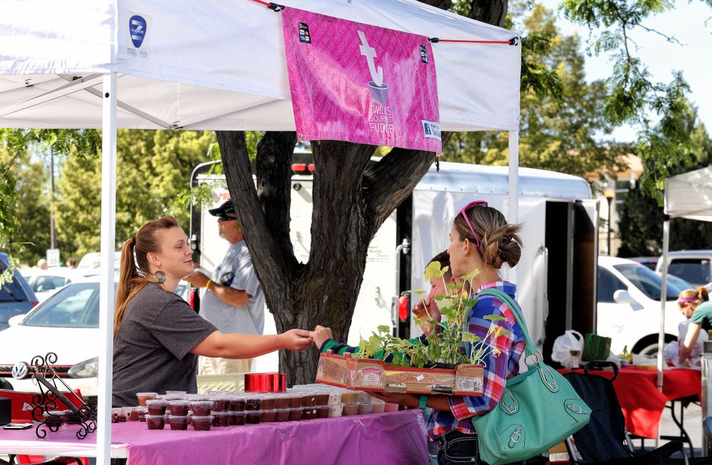 A woman purchasing products at Idaho Falls Farmers' Market