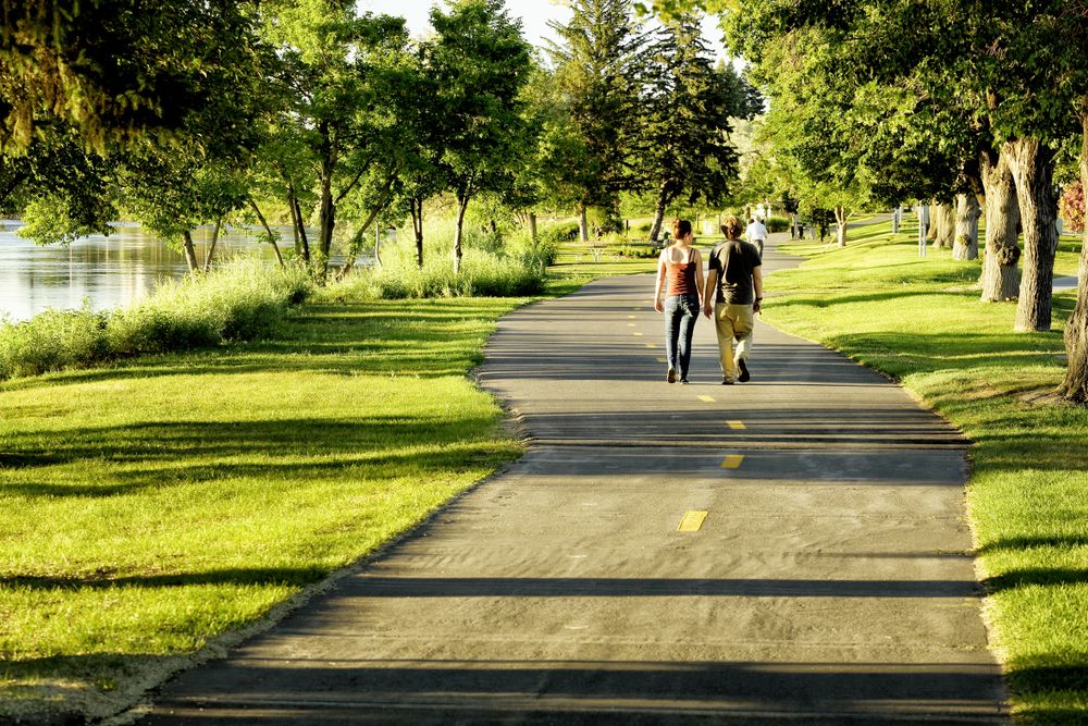 People walking along Idaho Falls Greenbelt