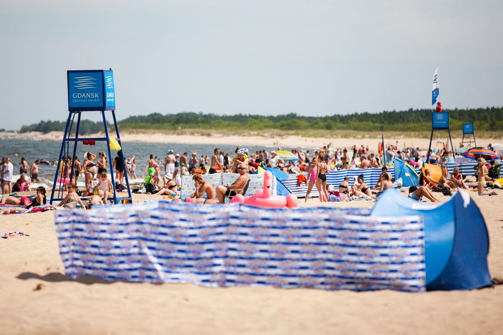 People enjoying at Jelitkowo Beach on a sunny day