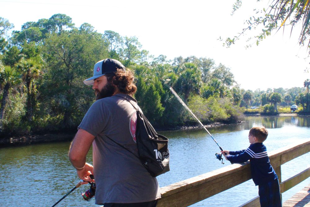 Visitors fishing in Jenkin's Creek Park