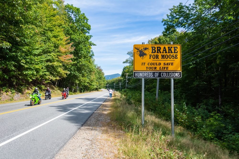 Bikers riding along the Kancamagus Highway