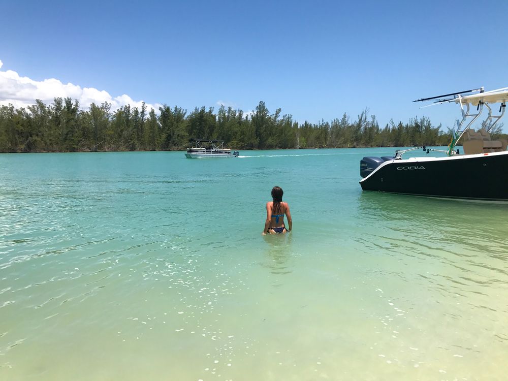 A person swimming on the Keewaydin Island