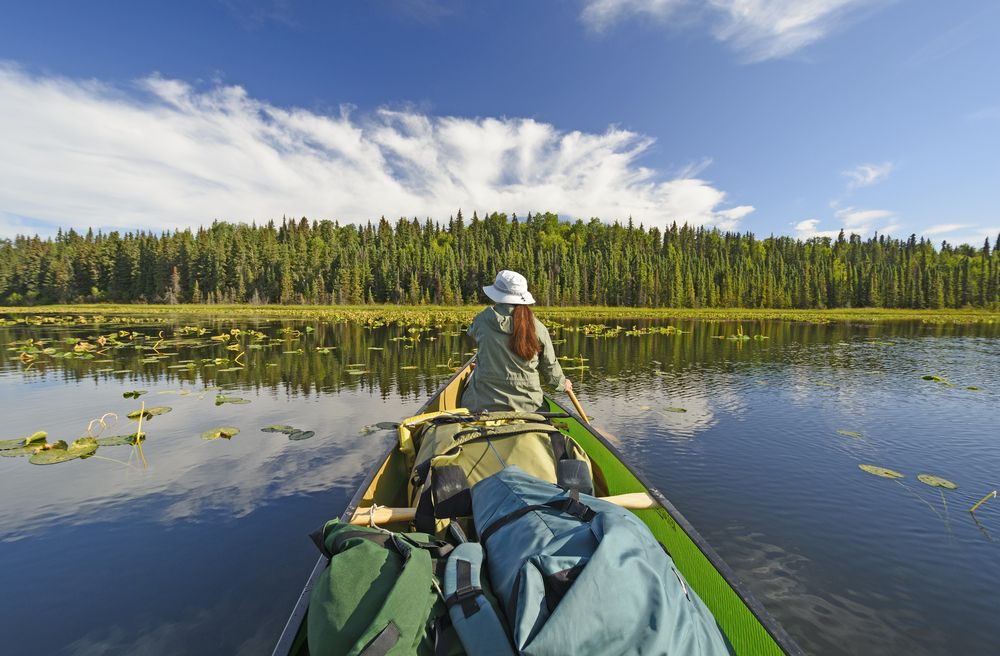 A woman on a canoe at Kenai National Wildlife Refuge.