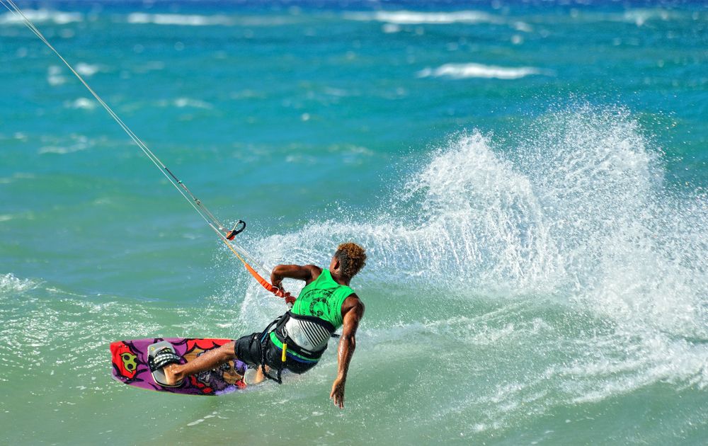 A man performing stunts at the Kite Beach