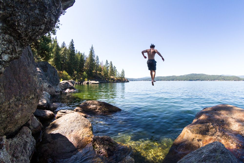 A young man diving into Lake Coeur d'Alene