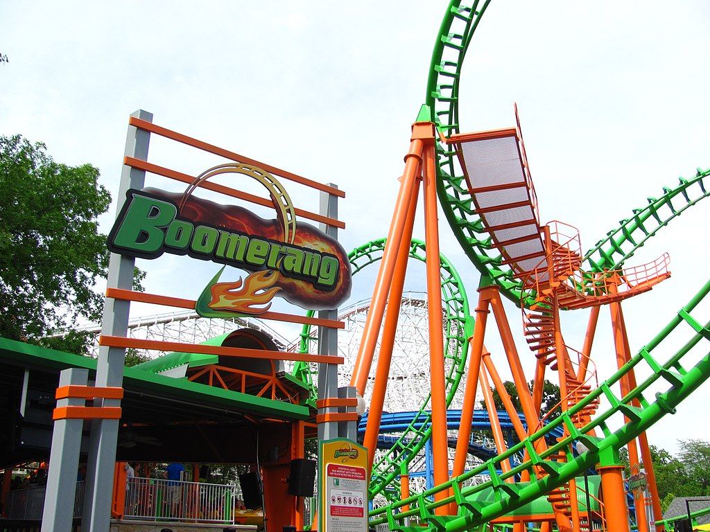 Tall, bright orange and green coloured boomerang ride.