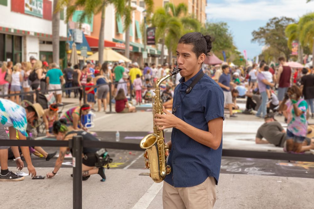 A man playing saxophone at Lake Worth Street Painting Festival