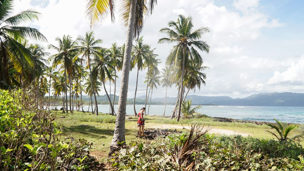 A young woman enjoying the tropical views of Las Galeras