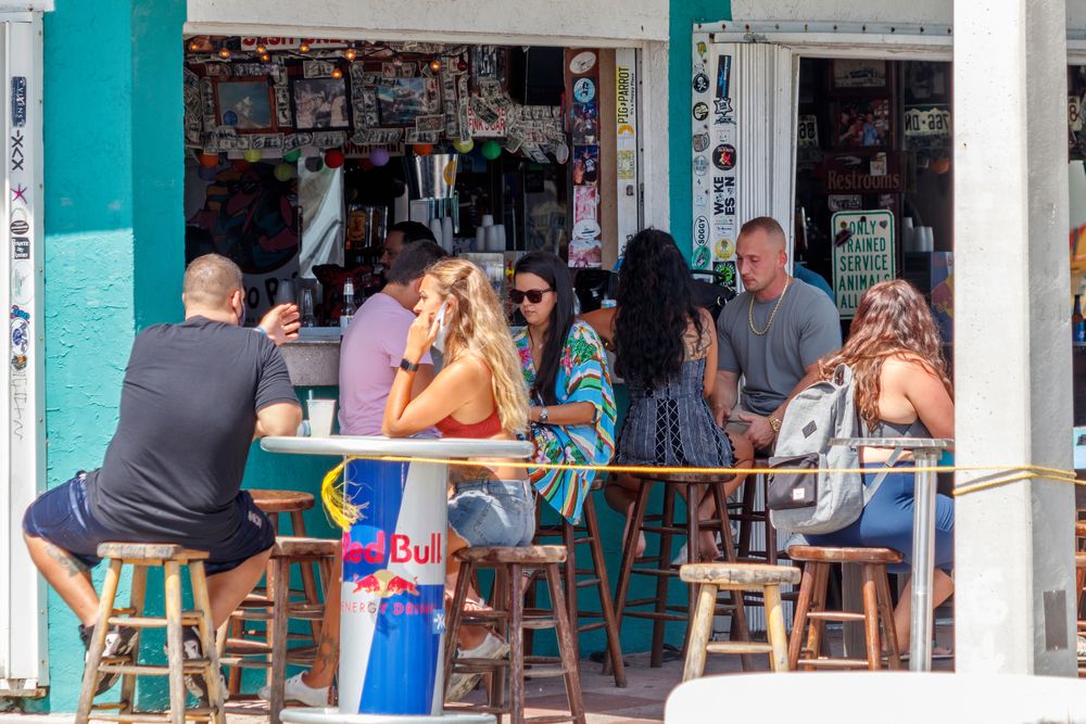 Tourists relaxing in a cafe at Las Olas Boulevard