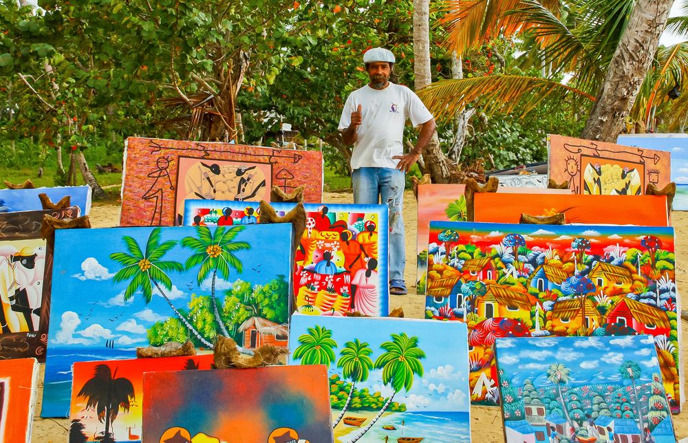 An artist selling his paintings at Las Terrenas Beach