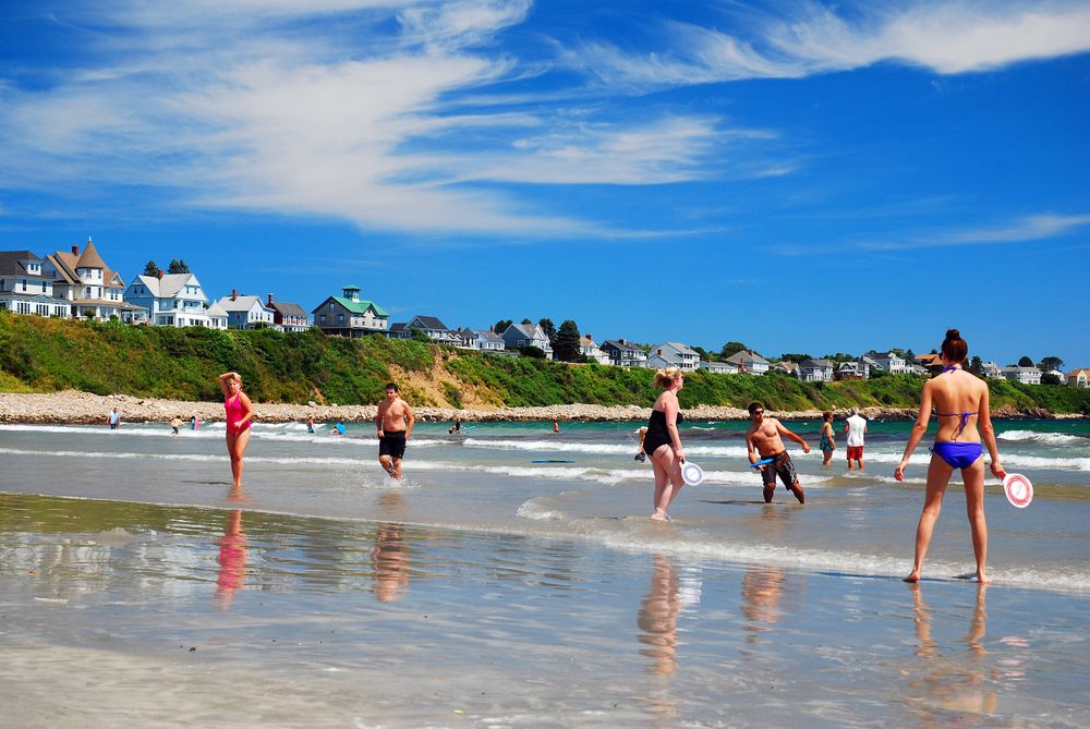 Tourist playing in Long Sands beach