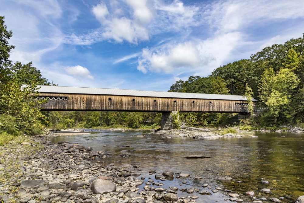 Stream flowing below the longest covered wooden bridge in Vermont