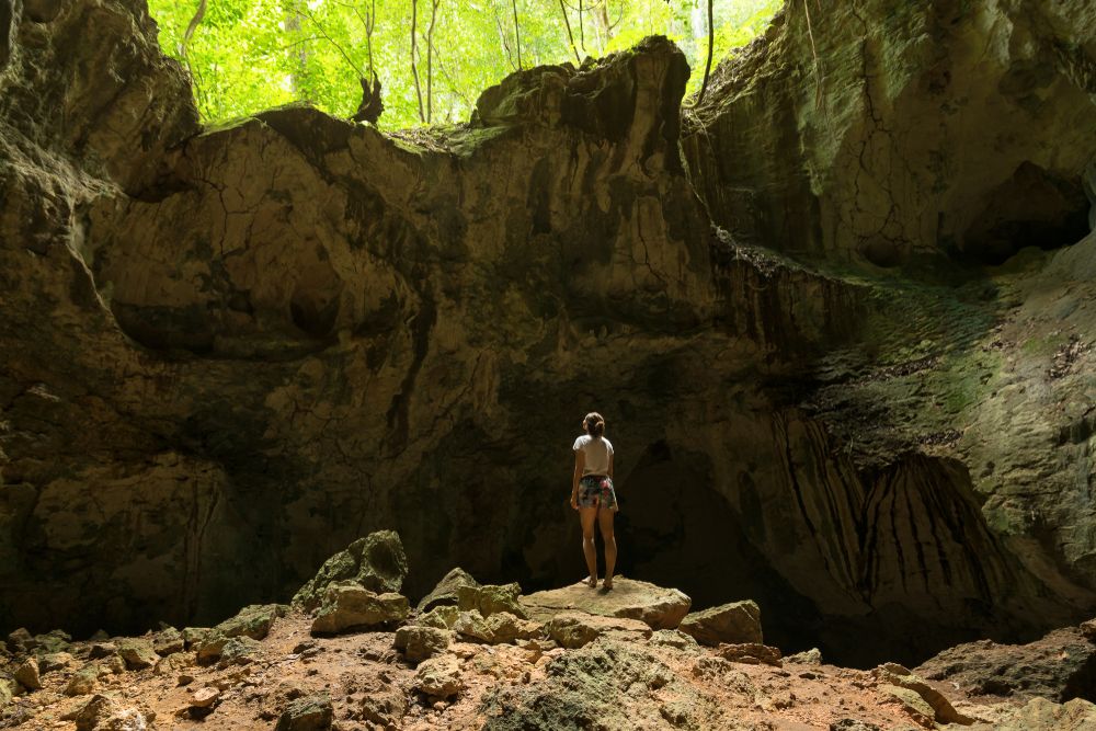 A woman exploring the caves at Los Haitises National Park