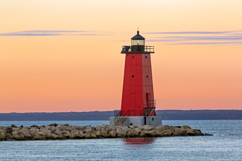 Scenic sunset over Manistique East Breakwater Lighthouse