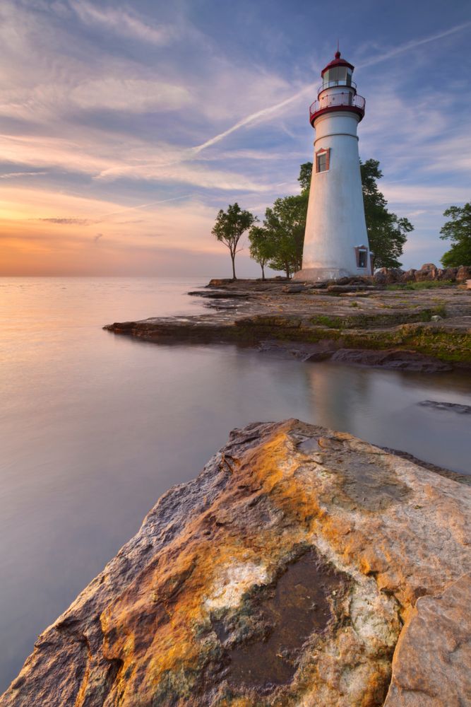Marblehead Lighthouse reflecting on a lake.