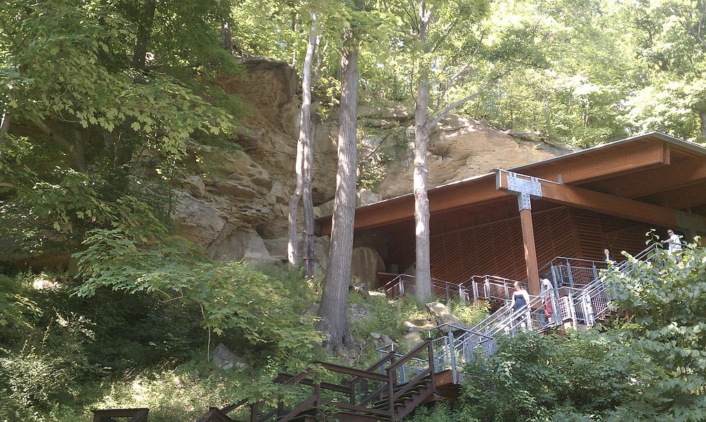 People climbing down the stairs at Meadowcroft Rockshelter and Historic Village