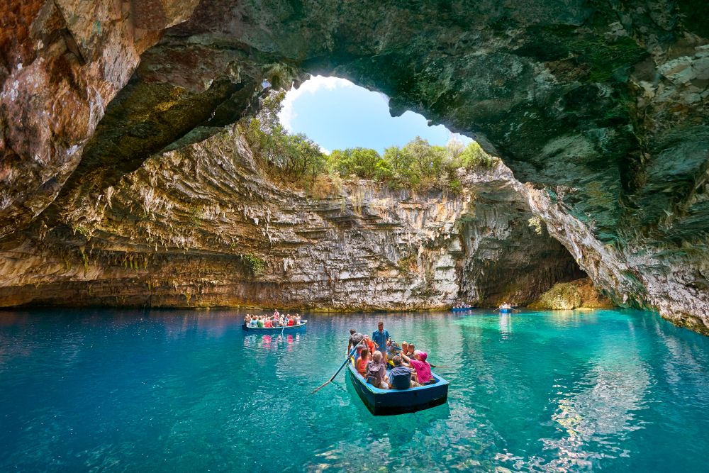 People on boats at Melissani Cave